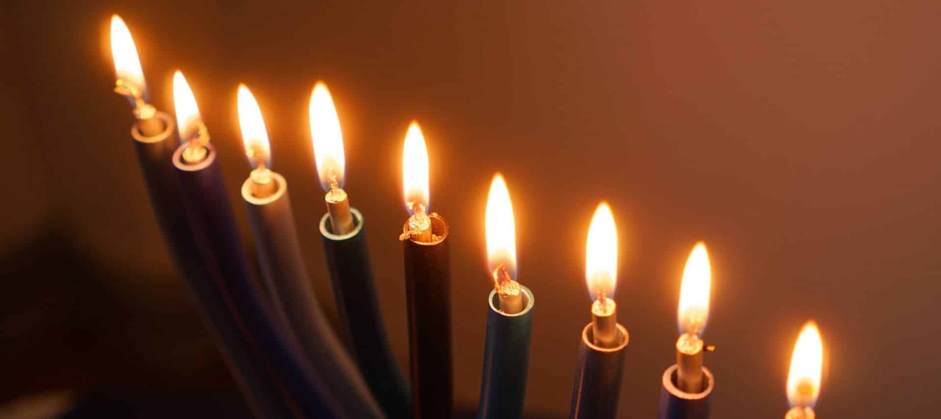 closeup of a lighted modern menorah