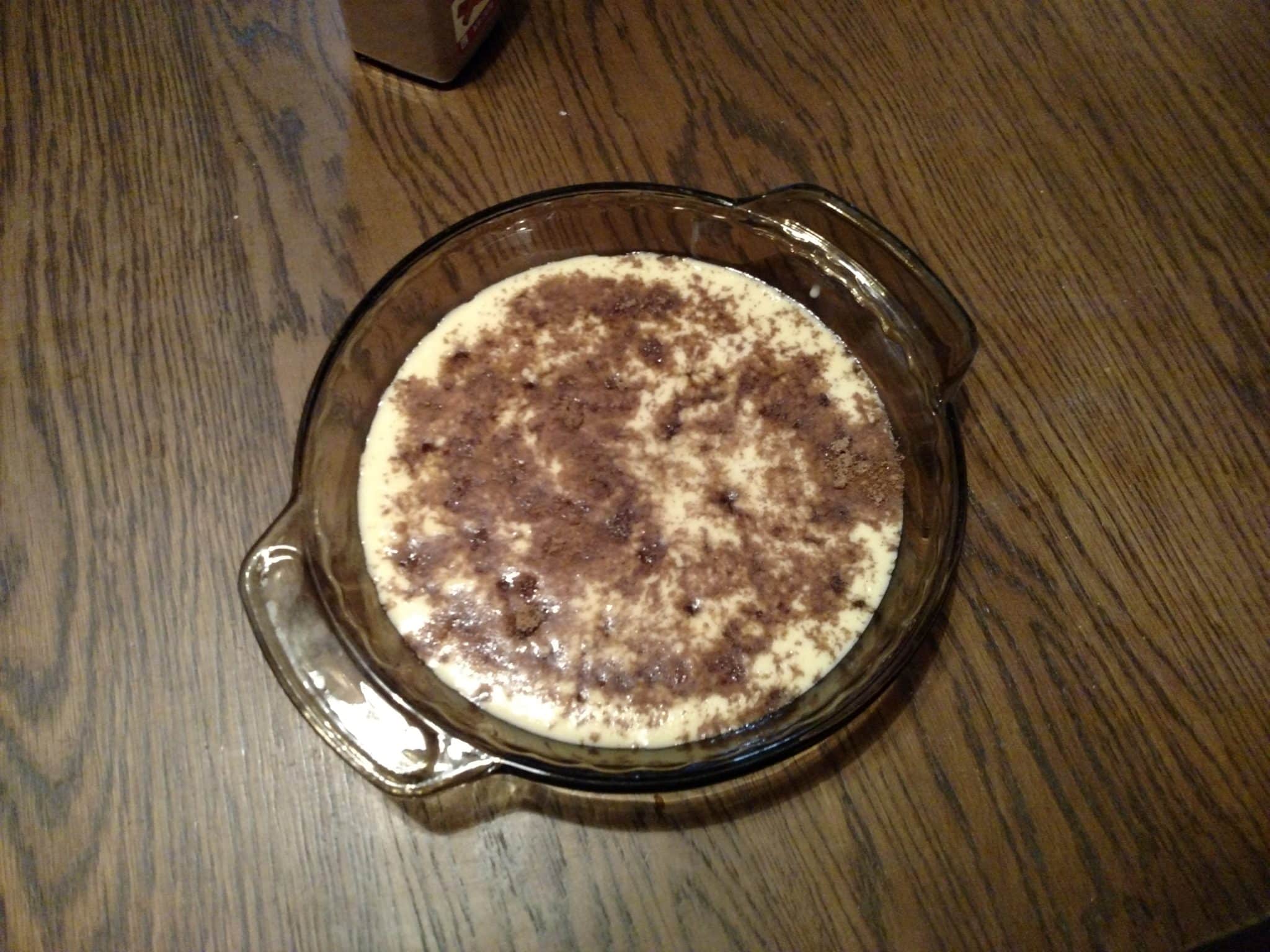 unbaked pancake batter in pie dish